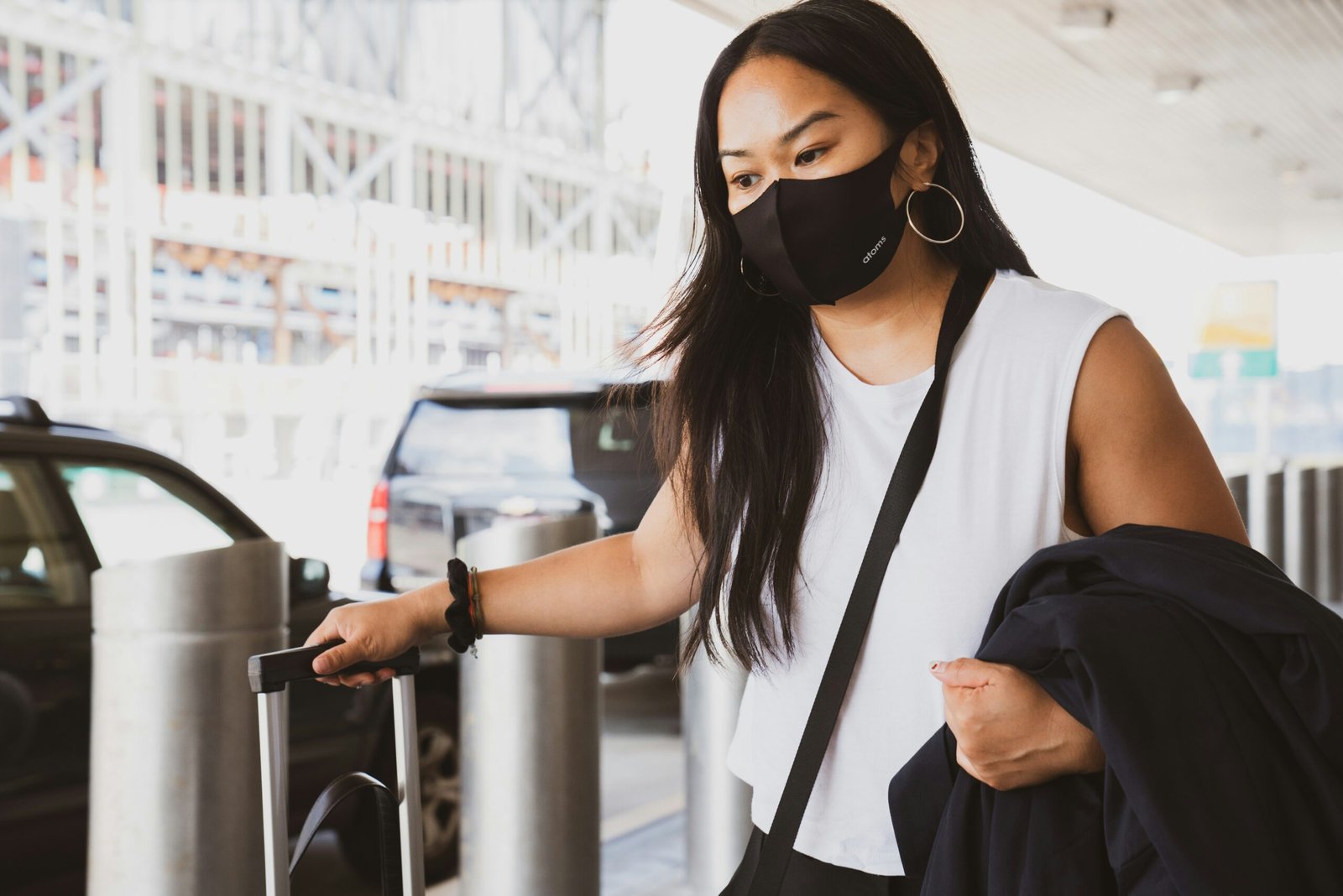 woman in black and woman in black and white tank top wearing black sunglasses
